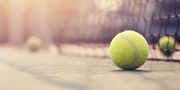 tennis-ball-hitting-the-tennis-net-at-tennis-court-with-copy-space_38350-13