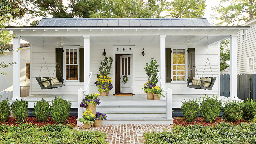 Small front porch with plants and door open