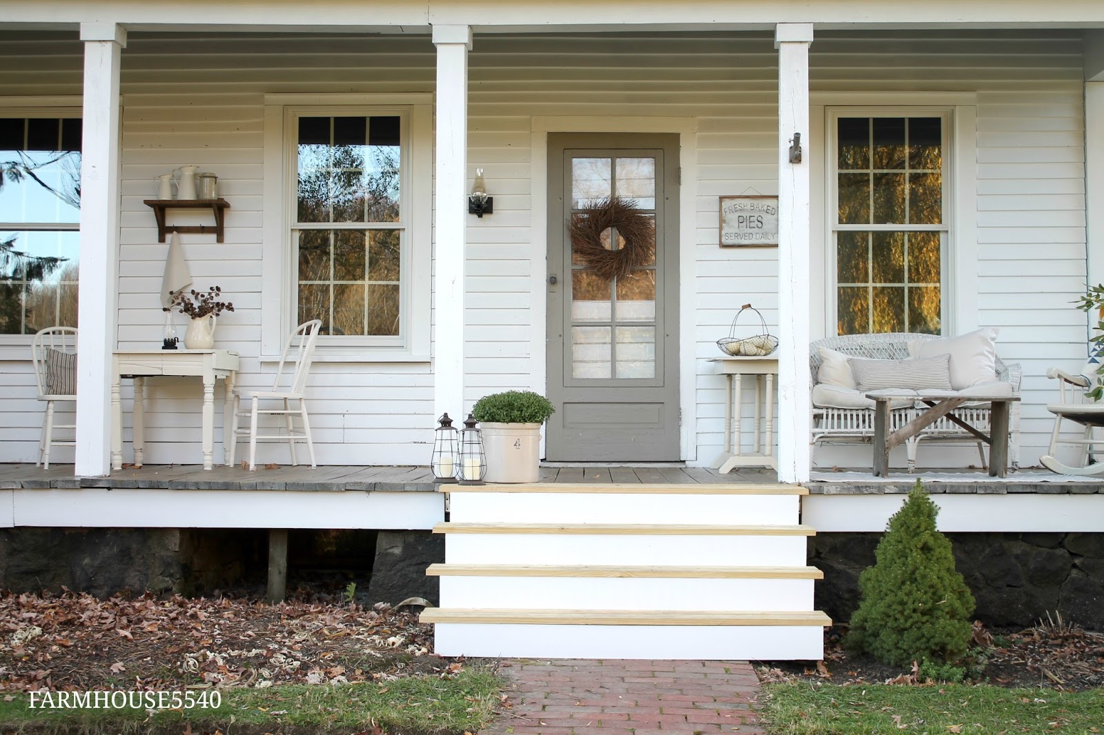 Front porch with steps and outdoor furniture