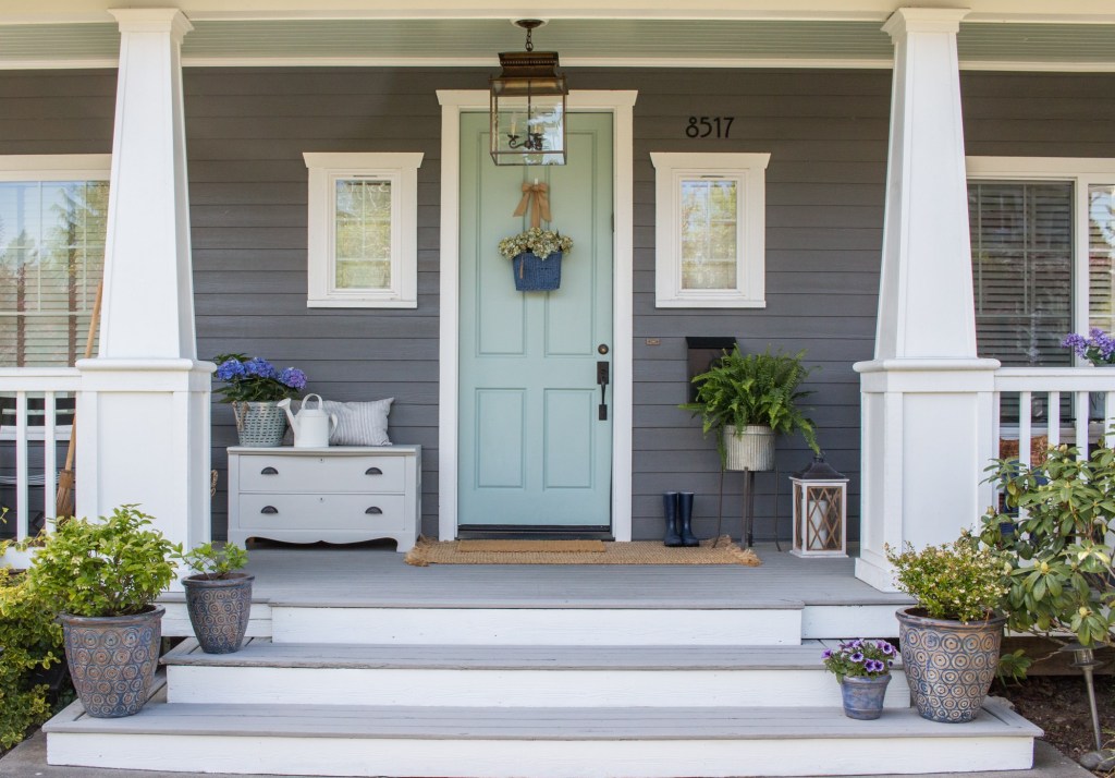 Cute front porch with outdoor furniture