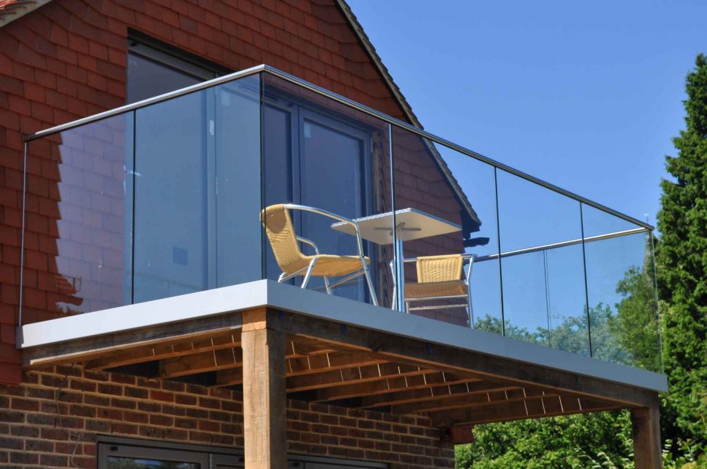 Home with small glass balcony