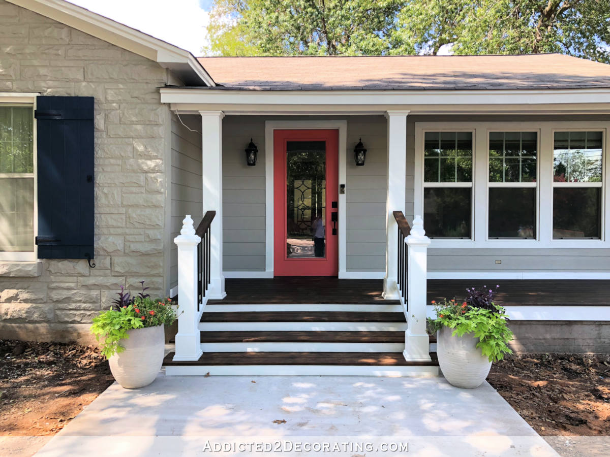 Front porch with red door and steps